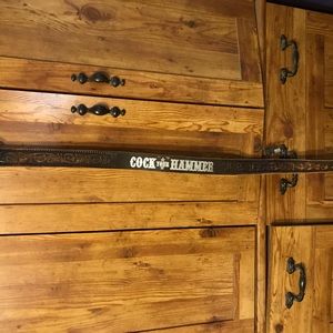 Brown Leather Belt with “Cock Your Hammer” printed in sliver on the back